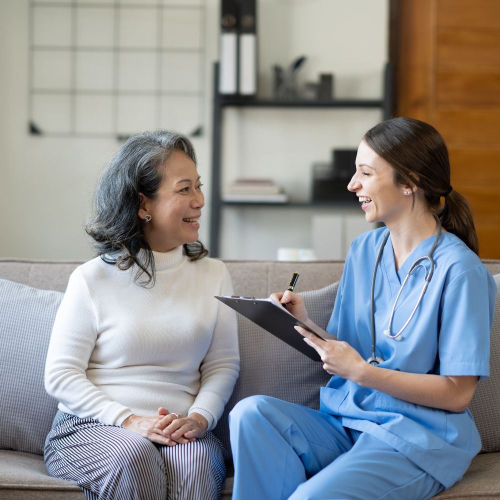 A Gynecologist in Noida, smiling in a clinic environment.